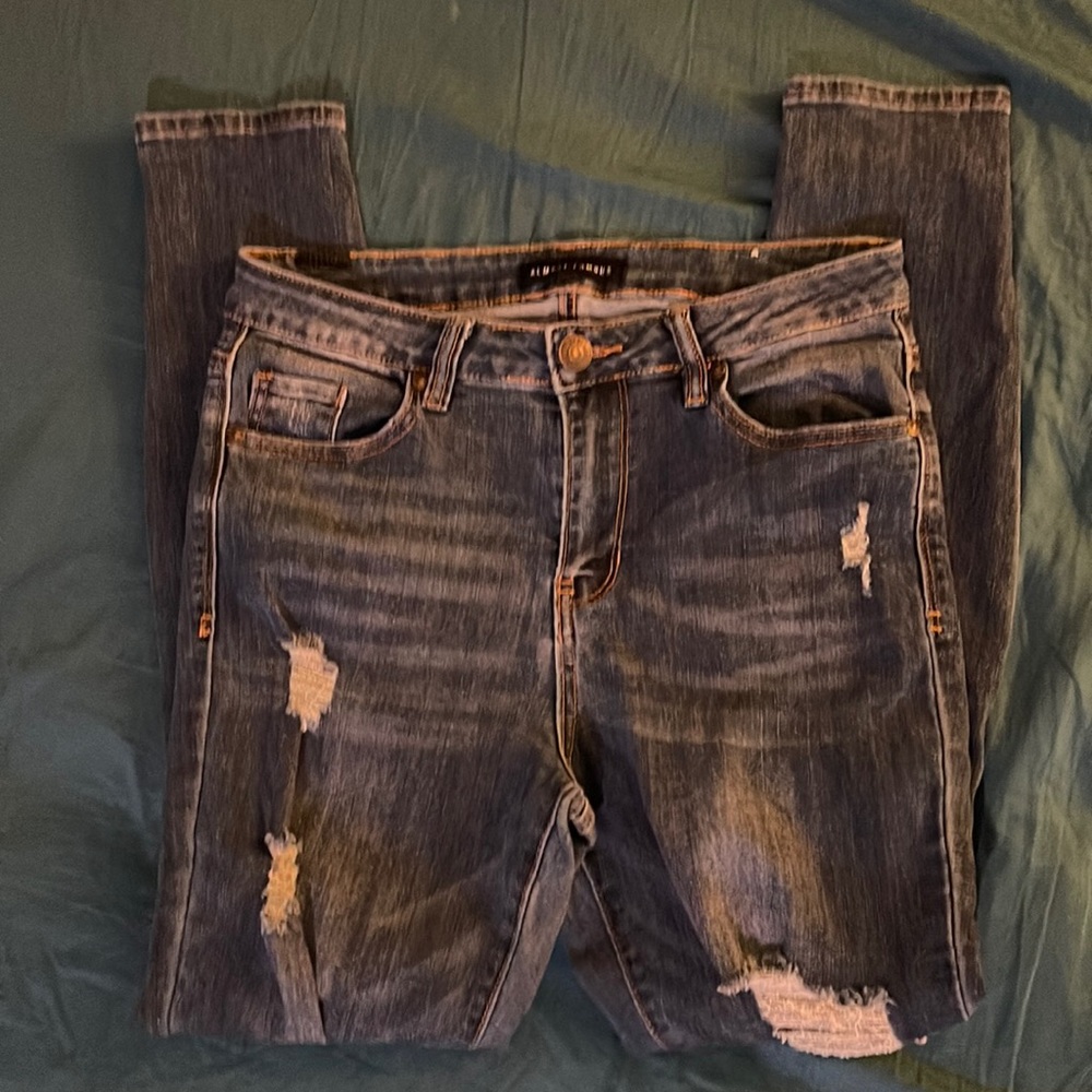 Used ripped blue jeans size 7